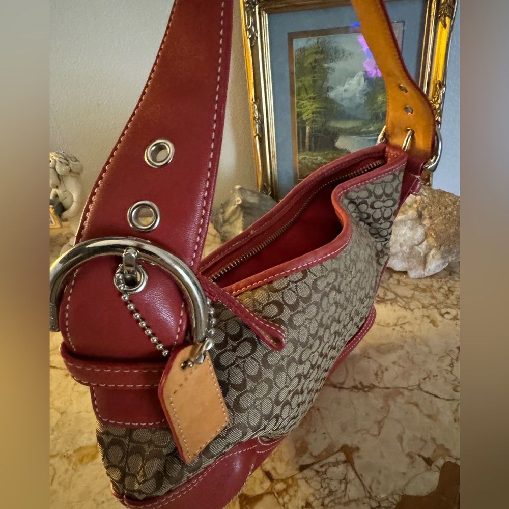 Coach red leather accent handbag.